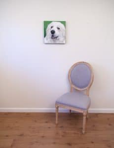 Pet portrait of a french bulldog by artist Erica Eriksdotter and a chair