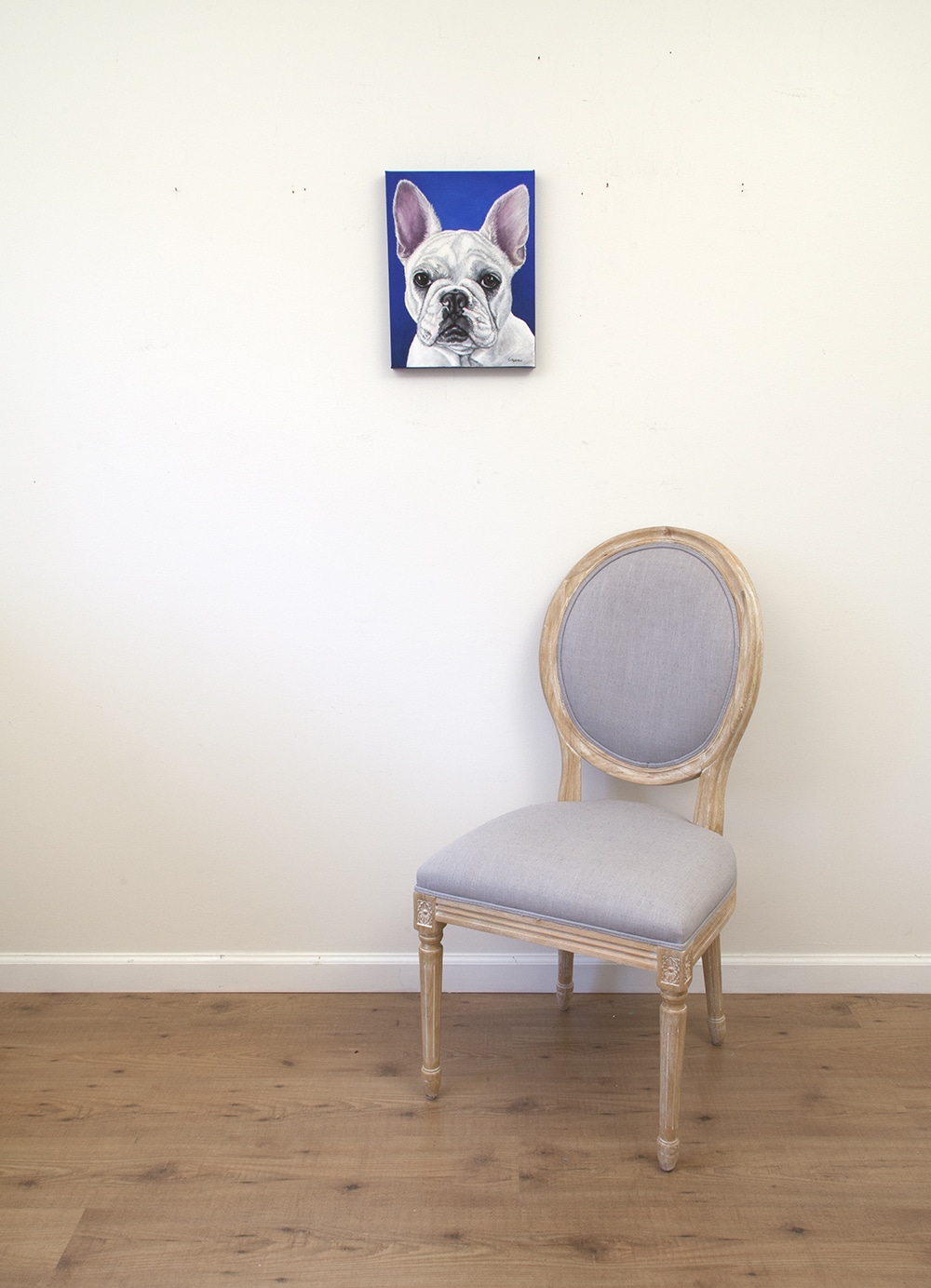 Pet portrait of a french bulldog by artist Erica Eriksdotter and a chair