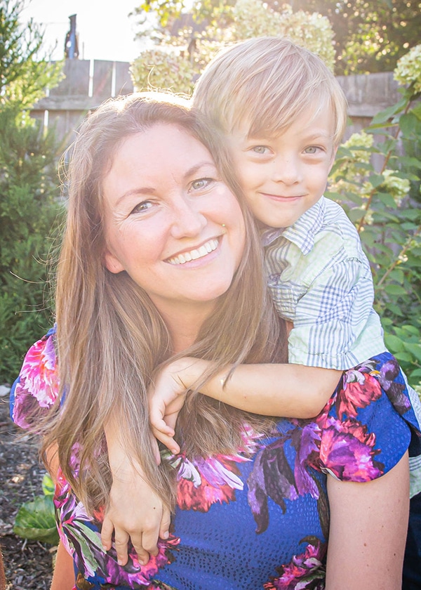 Artist, Erica Eriksdotter, with her son in a garden