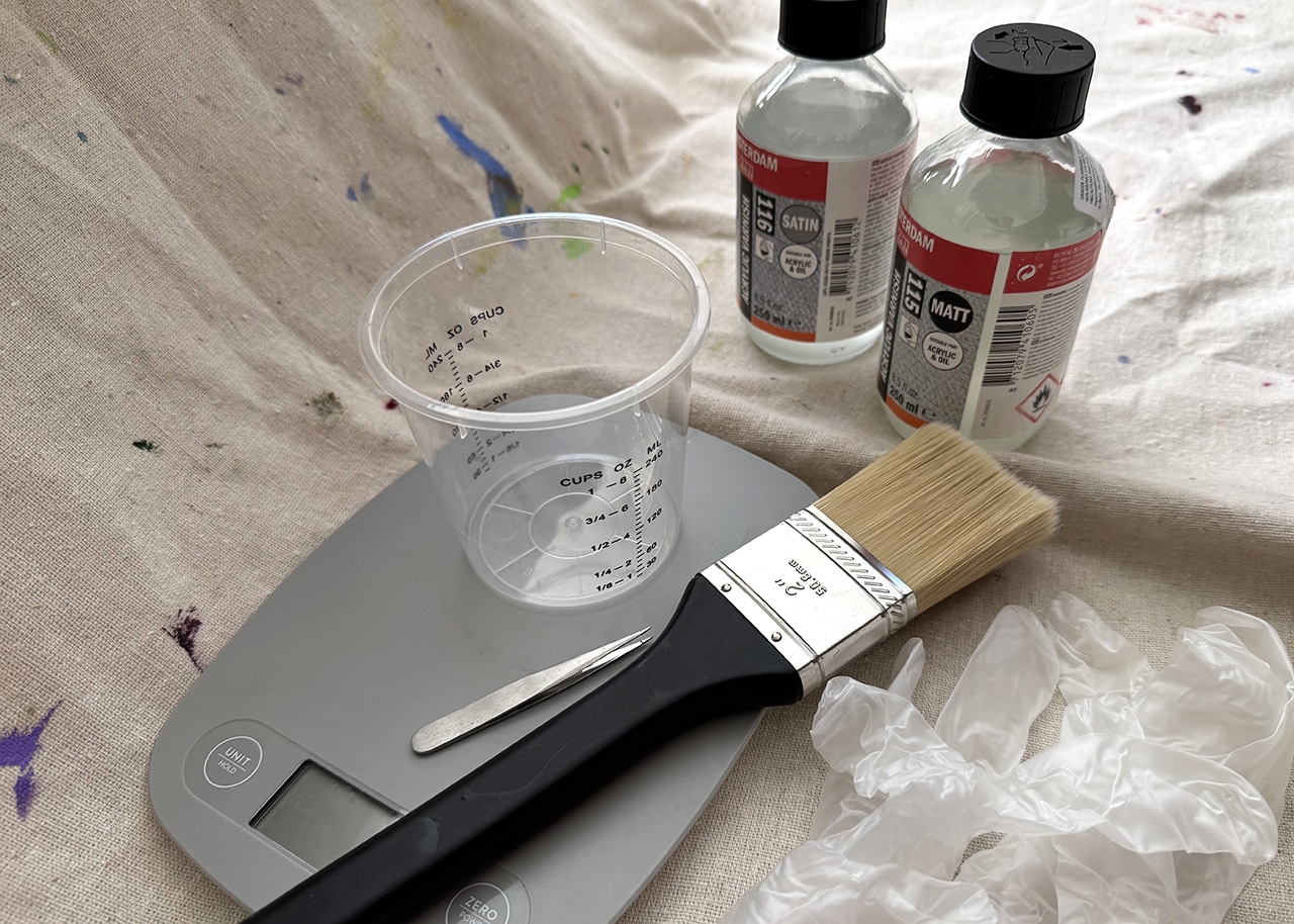 Erica Eriksdotter getting ready to varnish an heirloom pet portrait.