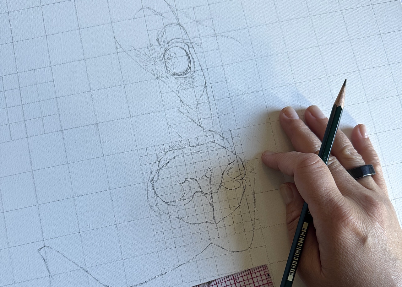 Erica Eriksdotter painting the eyes of a pet portrait.